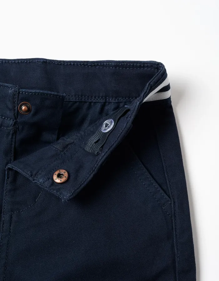 Pants with front button, striped detail and slant pockets