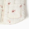 Padded vest with floral pattern and pockets for baby girls, light beige