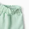 Shorts in cotton and linen with ruffled hem for baby girls, light green