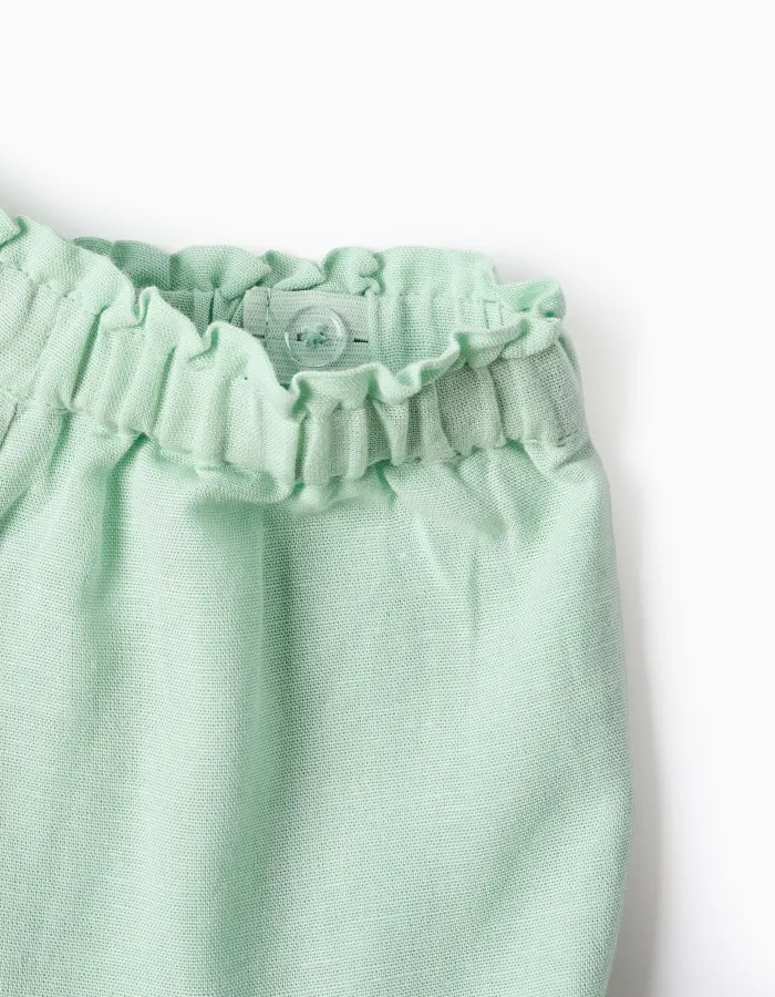 Shorts in cotton and linen with ruffled hem for baby girls, light green
