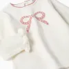 Knitted jumper with jacquard bow for baby girls, white/pink