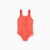 Swimsuit with star motif in bouclé for baby girls, neon coral