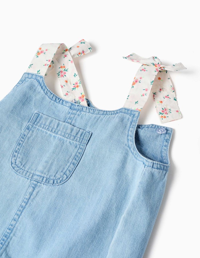 Denim playsuit with floral straps for baby girls, light blue