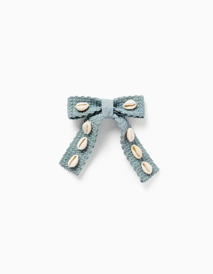 Hair slide with bow and cowrie shells for girls, light green