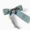 Hair slide with bow and cowrie shells for girls, light green