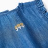 Denim poncho-styled top with ruffles and embroidery for girls, blue