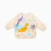 Jurassic Waterproof Soft Bib with Sleeves and Pocket by Miniland