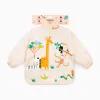 Jungle Waterproof Soft Bib with Sleeves and Pocket by Miniland