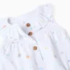 Sleeveless cotton romper with motif and ruffles for newborn girls, white