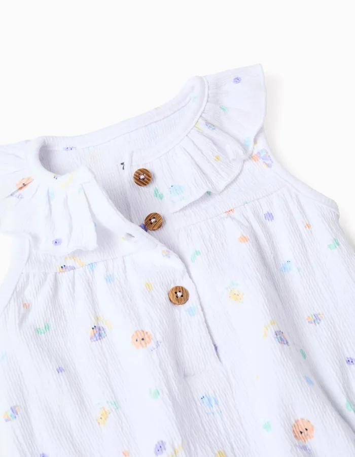 Sleeveless cotton romper with motif and ruffles for newborn girls, white