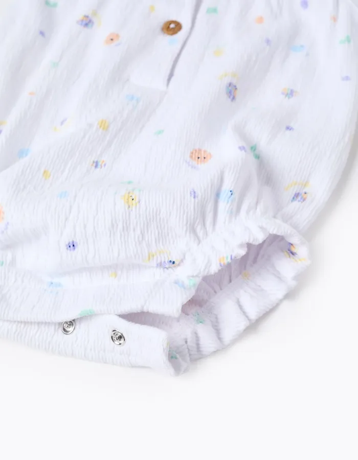 Sleeveless cotton romper with motif and ruffles for newborn girls, white