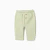 Trousers with plush lining for newborn girls, light green