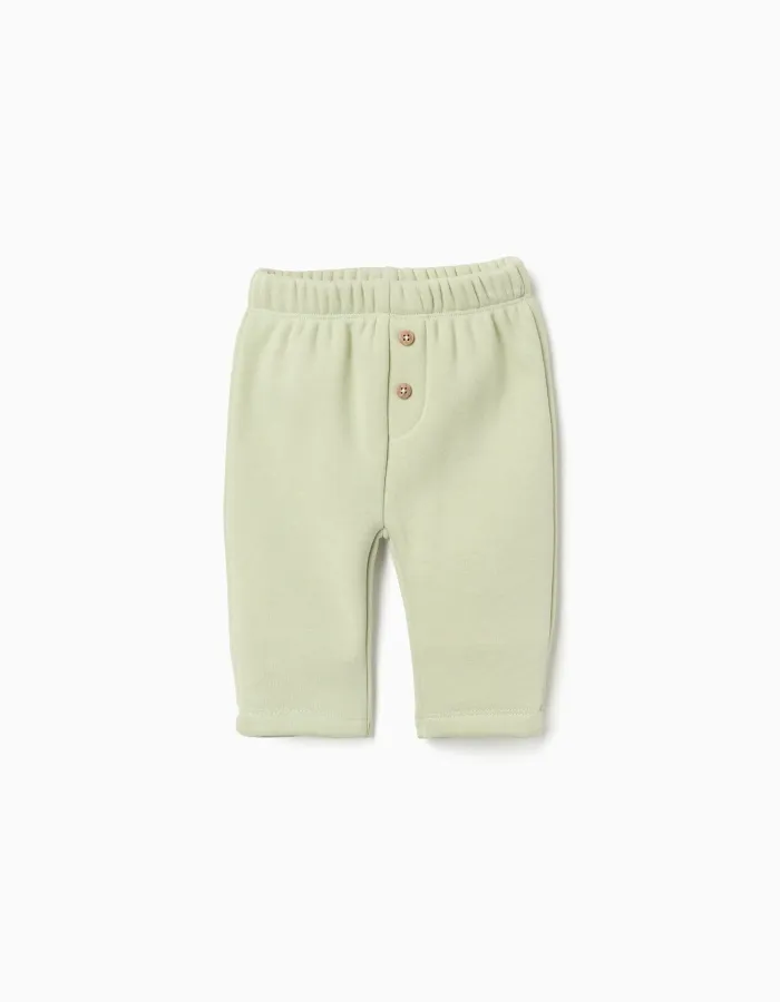 Trousers with plush lining for newborn girls, light green