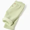 Trousers with plush lining for newborn girls, light green