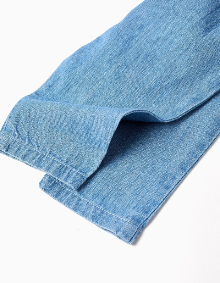 Denim trousers with removable straps for newborn girls, blue