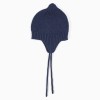 Knitted beanie with side straps for newborn boys, navy blue