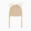 Knitted beanie with pompons and straps for newborns, beige/white