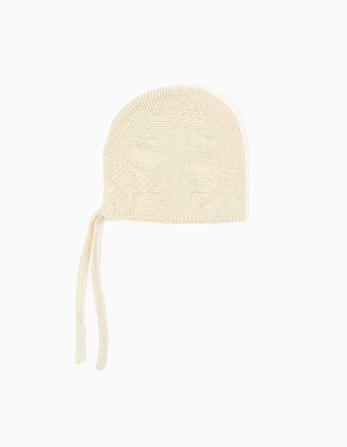 Cotton knitted cap with straps for newborns, light beige