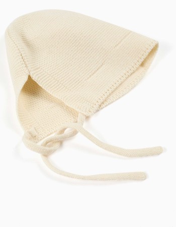 Cotton knitted cap with straps for newborns, light beige