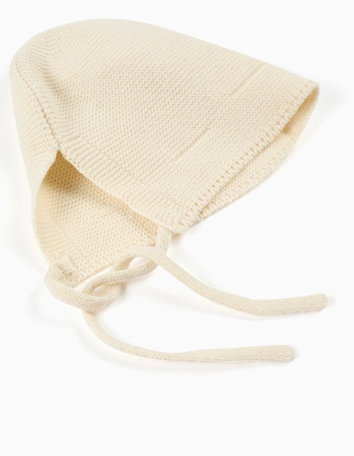 Cotton knitted cap with straps for newborns, light beige