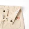 Flared twill trousers with embroidery for baby girls, light beige